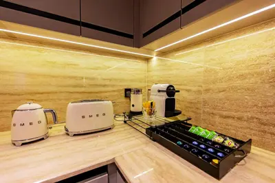 a kitchen with two toasters on a counter at VIP Experience Dubai Downtown at Boulevard Central T2 - Burj Khalifa View - Modern Luxury Apartments in Dubai