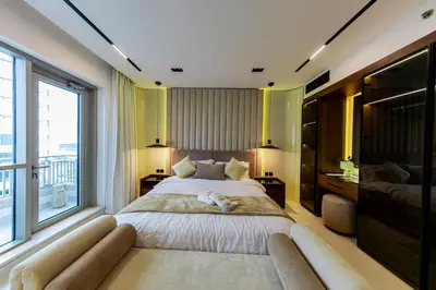 a bedroom with a large bed with a large window at VIP Experience Dubai Downtown at Boulevard Central T2 - Burj Khalifa View - Modern Luxury Apartments in Dubai