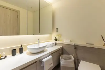 a bathroom with a sink and a mirror at Dubai Creek - Bright & Beautiful 1BR in The Cove in Dubai
