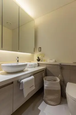 a bathroom with a sink and a mirror at Dubai Creek - Bright & Beautiful 1BR in The Cove in Dubai