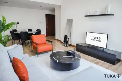 a living room with a couch and a table at 3-BHK - Dubai Marina - 44th Floor - 5mins to beach in Dubai