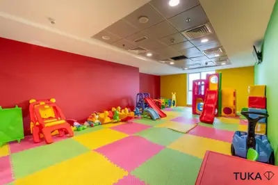a room with a play room with a tikka at 3-BHK - Dubai Marina - 44th Floor - 5mins to beach in Dubai