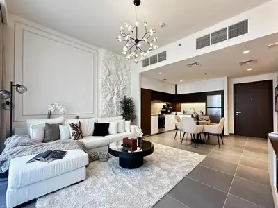 a living room with a couch and a table at Trophy - Ultra Luxury Suite with Fireplace in Dubai