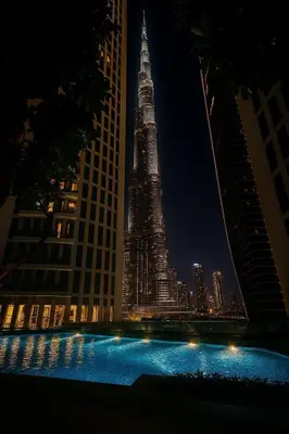 a view of the shanghai tower at night at Stunning Burj Khalifa & Fountain view - Dubai Mall Access, Burj vista Downtown Dubai in Dubai
