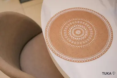 a toilet seat with a white embroidery on it at Skyline & Lake views - Home Cinema - 1-BHK - Prime Location in Dubai