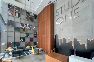 a lobby of a store with a sign on the wall at GuestReady - Lux nest near JBR beach in Dubai