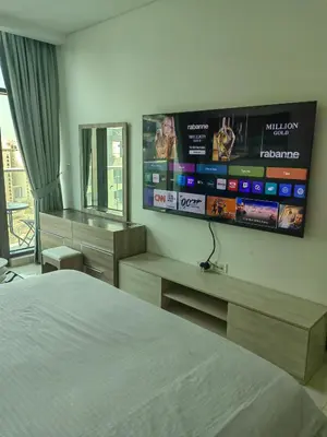 a bedroom with a bed and a flat screen tv at 7 palm jumeirah West Beach in Dubai