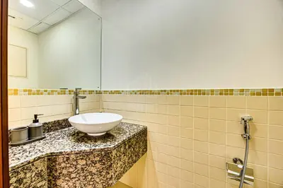a bathroom with a white sink on a counter at Luxury 2Bedroom with Stunning Sea View in JBR in Dubai