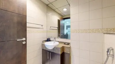 a bathroom with a sink and a mirror at Bay Central - One Bedroom with Marina View in Dubai
