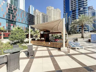 a gazebo with chairs and a table in a city at Bay Central - One Bedroom with Marina View in Dubai