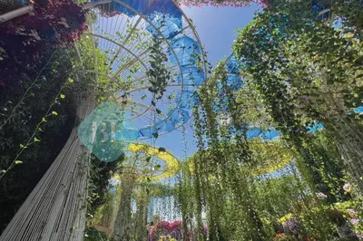 a ferris wheel and a bunch of flowers at Bloomfields Hidden Gem Studio In Arjan in Dubai