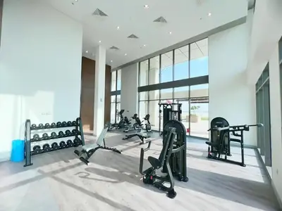 a gym with treadmills and ellipticals in a building at Farhad Azizi Residence - Al Jaddaf by Golden Casa in Dubai