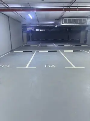 an empty parking lot in a parking garage at Chic and Cozy Studio in Dubai