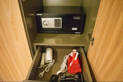 a room with a door open with a telephone in aiger at Heavenly Adobe in Dubai