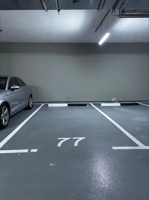 a parking garage with a car parked in it at Heavenly Adobe in Dubai