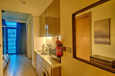 a bathroom with a sink and a mirror on the wall at Paradise Point in Dubai