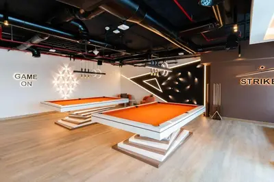 two ping pong tables in a room at New building l Near Metro l Spacious lay out in Dubai