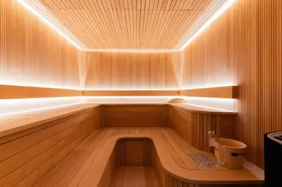an empty sauna with a wooden floor and a ceiling at New building l Near Metro l Spacious lay out in Dubai