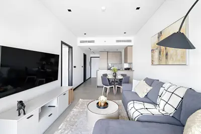 a living room with a couch and a table at 1 Bedroom with Canal View - 15 Northside in Dubai