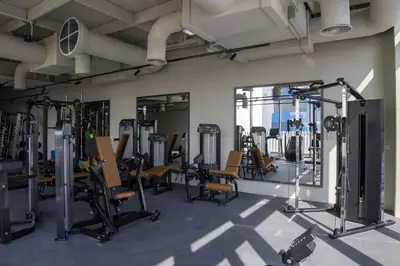 a gym with a lot of treadmills and machines at Business-Ready Executive Studio with Burj View in Dubai