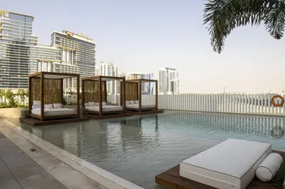 a swimming pool with a resort style poolvisorvisorvisor at Business-Ready Executive Studio with Burj View in Dubai