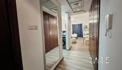 a hallway with a mirror and a room at Rare Holiday Homes - Mediterranean Cluster - Near Ibn Battuta Mall - Discovery Garden - Building# Med 49 - R213 in Dubai
