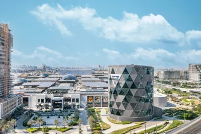 an aerial view of a building in a city at Cozy 1BR Near Dubai Hills Park in Dubai