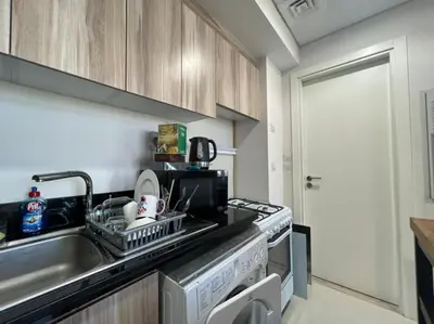 a kitchen with a sink and a dishwasher at Damac Golf vita in Dubai