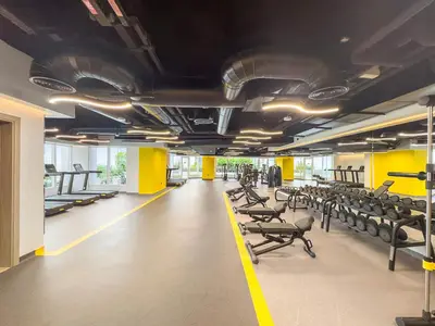 a gym with rows of chairs andcriptions on the ceilings at Stylish 1 BR Apartment close to JBR Beach in Dubai