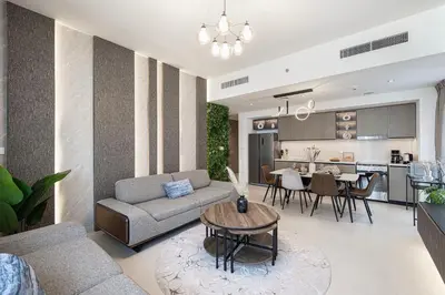 a living room with a couch and a table at City Views, Pool & Gym Near Iconic Burj Khalifa in Dubai