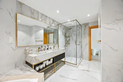a bathroom with a sink and a shower at 2BDR Luxury Apartment in Palm in Dubai