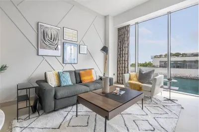 a living room with a couch and a table at GuestReady - Marvellous stay in Marina | Canal View in Dubai