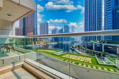 a balcony with a view of the city at ShoresInn - Charming 1BR with Marina Views in Dubai