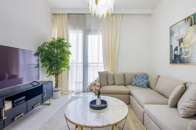 a living room with a couch and a table at Creekside, Creek Harbour 1 BDR in Dubai