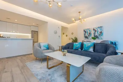 a living room with a couch and a table at Spacious 1br in Ahad, Business Bay in Dubai