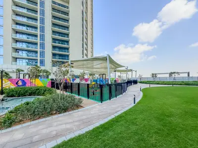 a playground in a park with a building at DAYF-FSL 1-Bedroom in Business Bay near Downtown Dubai in Dubai