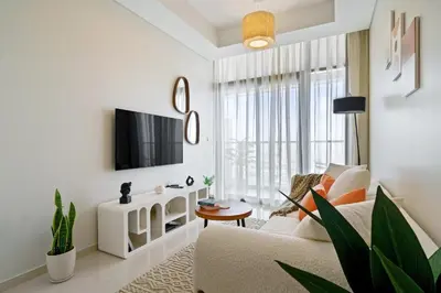 a living room with a couch and a tv at DAYF-FSL 1-Bedroom in Business Bay near Downtown Dubai in Dubai