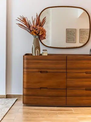 a dresser with a mirror on top of it at Prestigious 2BR-Noura Tower- Business Bay in Dubai