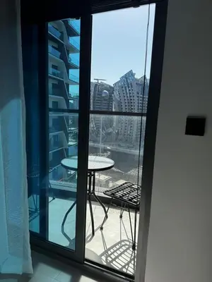 a balcony with a table and a view of a city at Luxury 1Br apartment, Canal view in Dubai