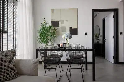 a dining room with a table and chairs at Luxury 1Br apartment, Canal view in Dubai