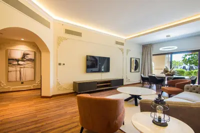 a living room with a couch and a tv at Fairmont Residences, Exquisite 2BR Luxury Retreat in Dubai