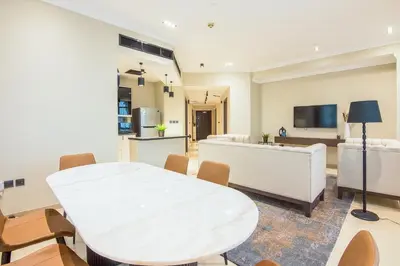 a living room with a white table and chairs at Marina Crown 2 BDR, Marina in Dubai