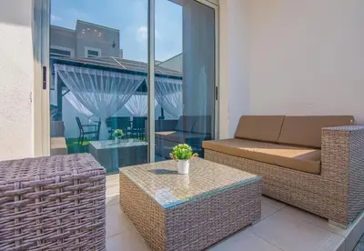 a living room with a couch and a table at Reem 3 BDR Villa in Dubai