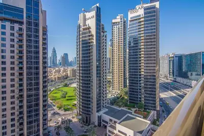 an aerial view of a city with tall buildings at Elite 1 BR, Downtown in Dubai