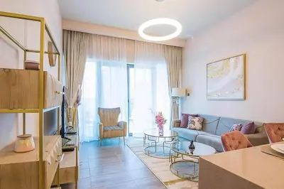 a living room with a couch and a table at MBL Residences 1 BR, JLT in Dubai