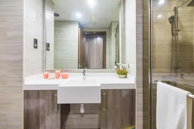 a bathroom with a white sink and a shower at MBL Residences 1 BR, JLT in Dubai
