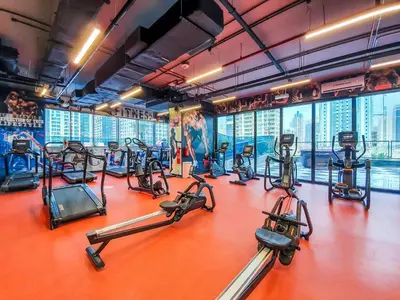 a gym with treadmills and elliptical machines at MBL Residences 1 BR, JLT in Dubai