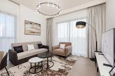 a living room with a couch and a table at Premium Apartments at Executive Residences in Dubai