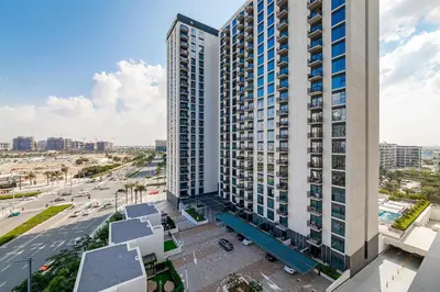 an aerial view of a tall building in a city at Premium Apartments at Executive Residences in Dubai