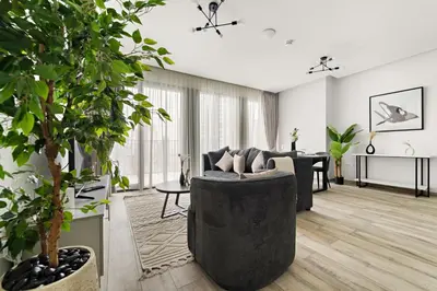 a living room with a couch and a table at StoneTree - Newly Furnished - Stylish in Dubai